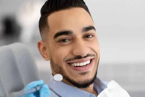 man smiling in dental chair